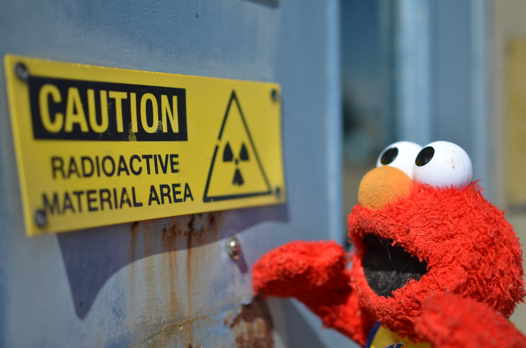 Elmo Looking at Caution Radioactive Material Area Sign
